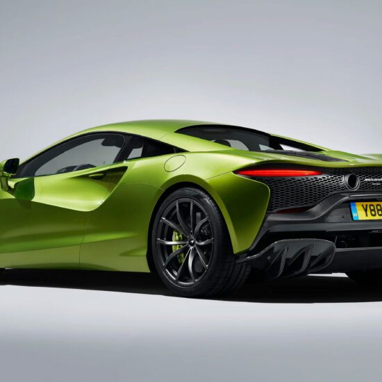 McLaren Automotive's High-Performance Hybrid super car in green shown against grey background.